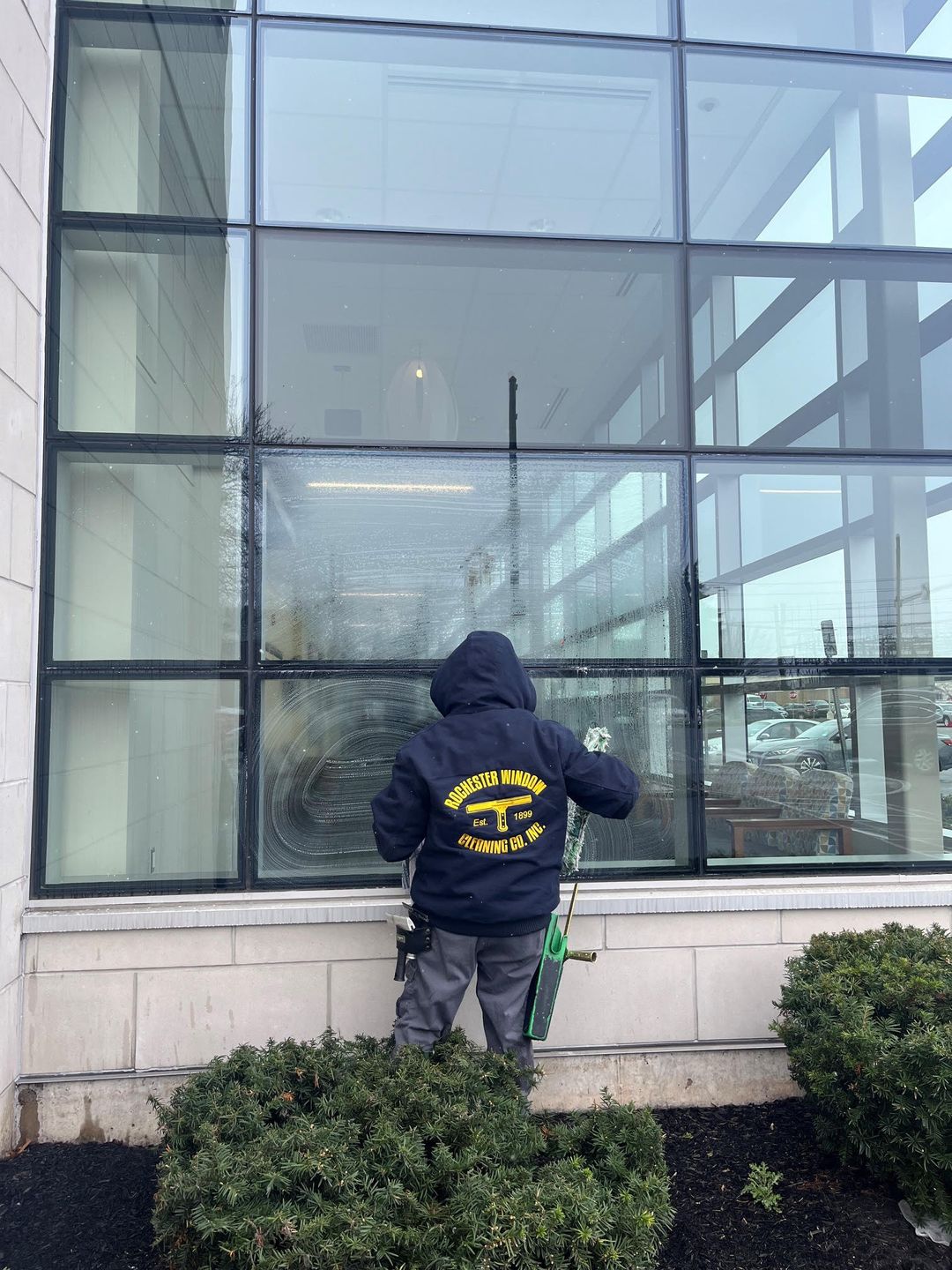 Modern kitchen with large window overlooking trees